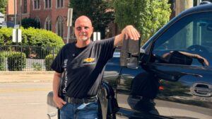 Jim Muncy standing beside his 2007 Chevrolet Silverado
